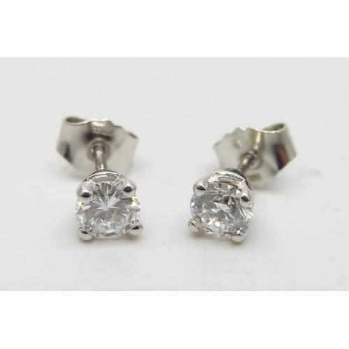 874 - A pair of hallmarked platinum diamond stud earrings, 0.81 carat total diamond weight