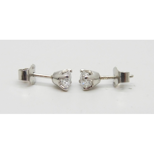 874 - A pair of hallmarked platinum diamond stud earrings, 0.81 carat total diamond weight