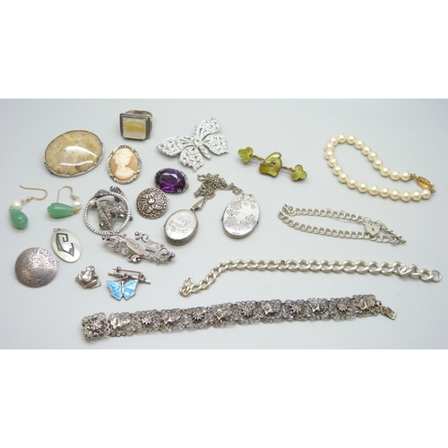 882 - A Victorian silver brooch, a silver bracelet, a silver chain lacking fasteners, a silver locket and ... 