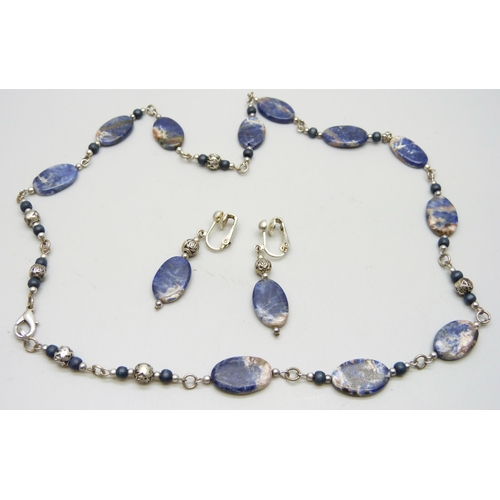 893 - A stone set necklace and matching earrings