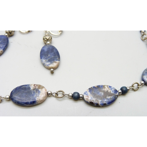 893 - A stone set necklace and matching earrings