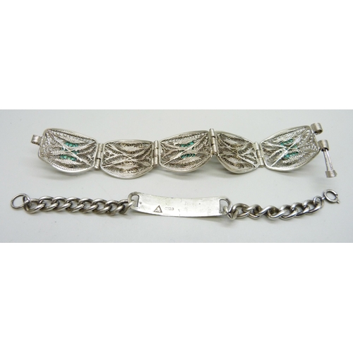 900 - An Egyptian scarab beetle bracelet and a silver Identity bracelet, (ID bracelet 23g)