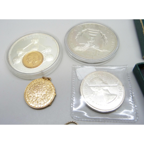 903 - A yellow metal locket, a chain, a/f, and coins including a Canadian silver dollar