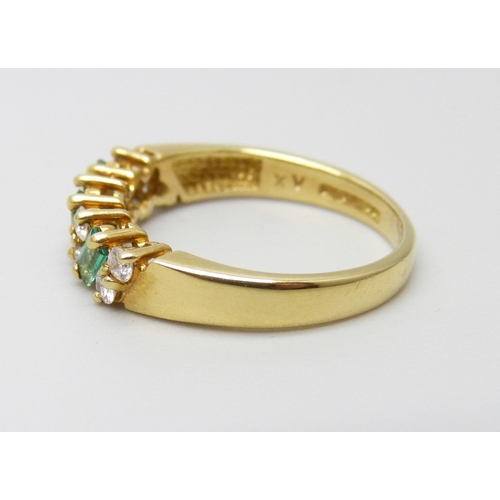 906 - An 18ct gold emerald and diamond ring, 3.7g, N