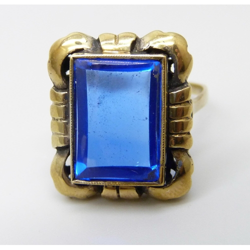 907 - A silver gilt cushion shape blue stone ring, O