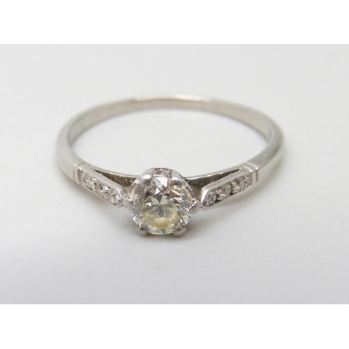 909 - A white metal set diamond solitaire ring, approximately .50ct weight, with diamond shoulders, 2.2g, ... 