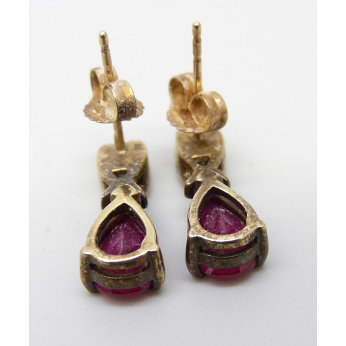 922 - A pair of 9ct gold red and white stone set pear drop earrings, 2.6g