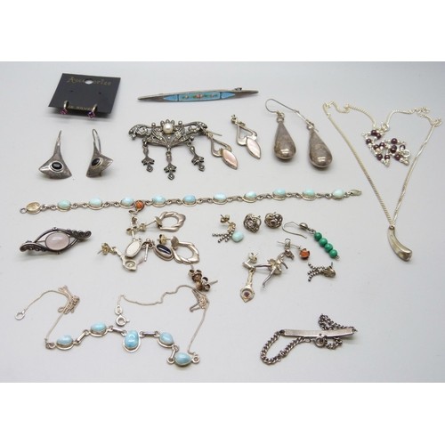 941 - A collection of silver jewellery including an enamelled brooch marked 800