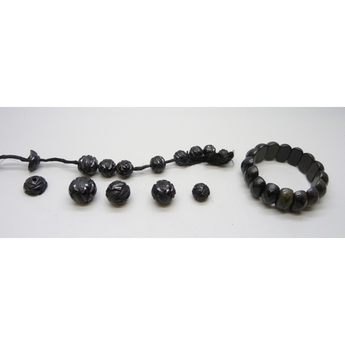 966 - Jet beads and a faceted stone bracelet