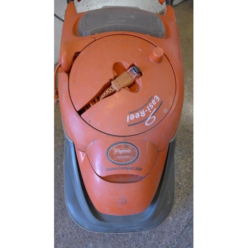 5176 - A Flymo Vision Compact 330 lawnmower with additional long extension lead and collection box