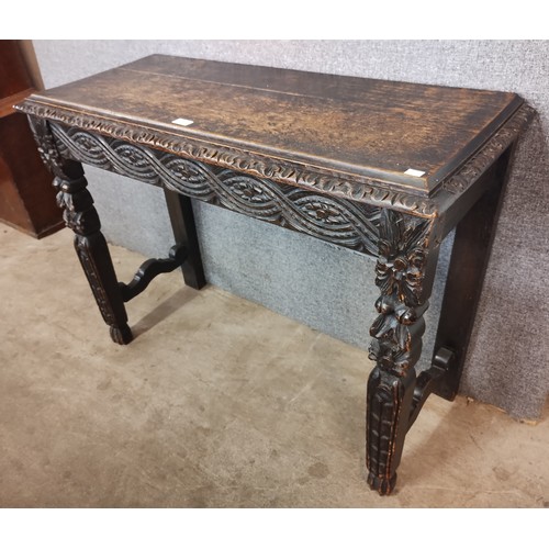 109 - A Victorian Jacobean Revival carved oak serving table