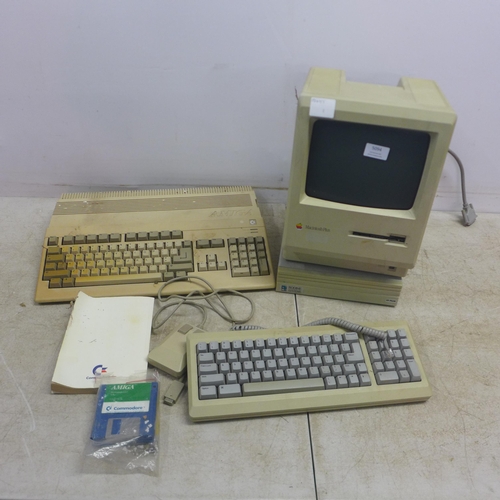 5094 - A vintage Apple Macintosh Plus 1mb personal computer, an Apple model M0110A keyboard and mouse with ... 