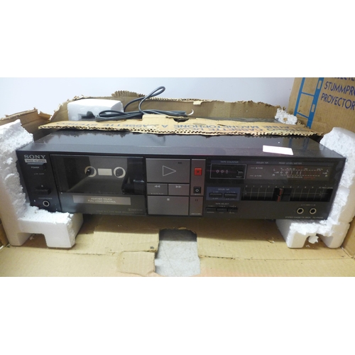 5106 - A Sony TC-FX310 tape deck, a Philips D-2122 portable radio and a movie projector