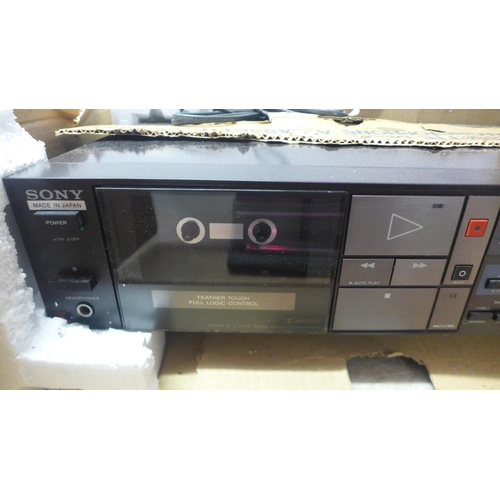 5106 - A Sony TC-FX310 tape deck, a Philips D-2122 portable radio and a movie projector