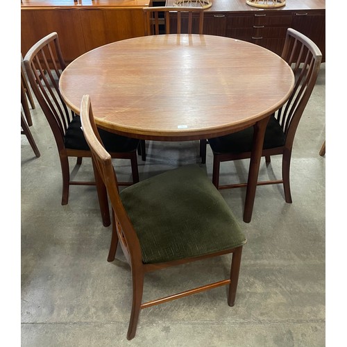 55 - A McIntosh teak circular dining table and four chairs