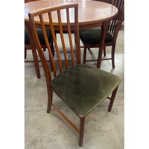 55 - A McIntosh teak circular dining table and four chairs