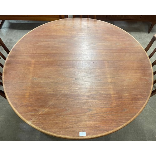 55 - A McIntosh teak circular dining table and four chairs