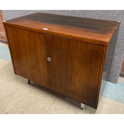 61 - A teak and chrome two door cabinet