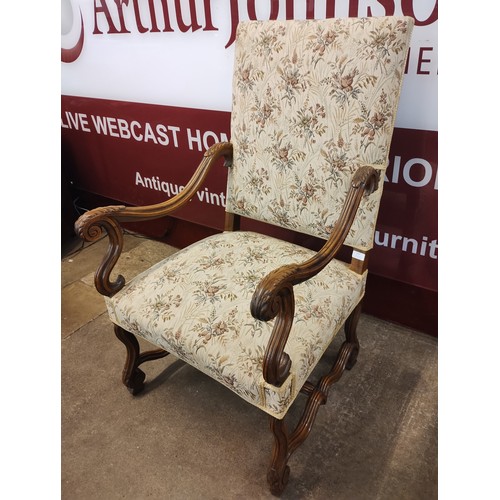 117 - A French Louis XV style carved walnut and fabric upholstered fauteuil armchair