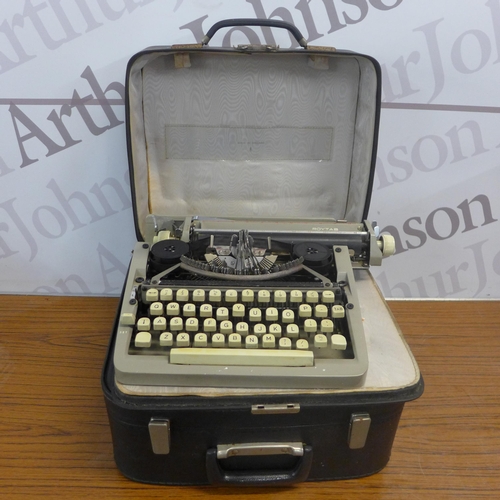 5295 - A Smith Corona SL470 electronic typewriter, a vintage Roytab typewriter, an Olympia Regina De Luxe t... 