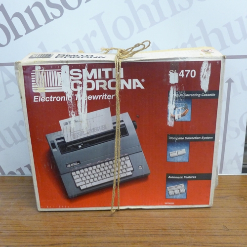 5295 - A Smith Corona SL470 electronic typewriter, a vintage Roytab typewriter, an Olympia Regina De Luxe t... 