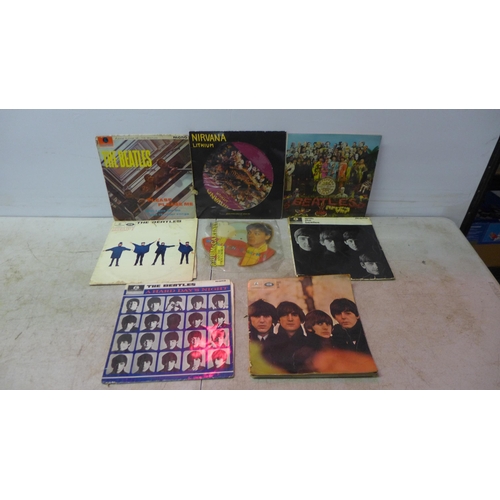 5112 - A box of LP records including The Beatles, Nirvana and a collectible Paul McCartney and the Frog Cho... 