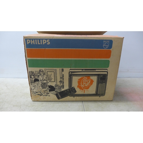 5123 - A portable Phillips TV with remote - late 70s early 80s