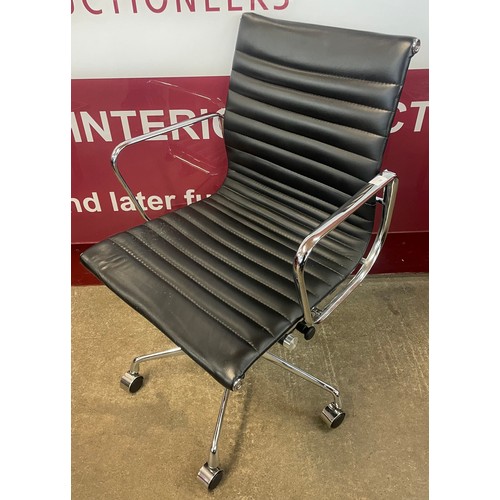 80 - An Eames style black leather and chrome revolving desk chair