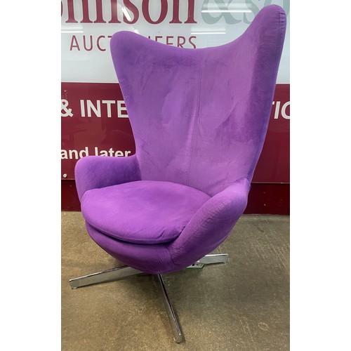 81 - An Arne Jacobsen style chrome and violet fabric upholstered revolving egg chair