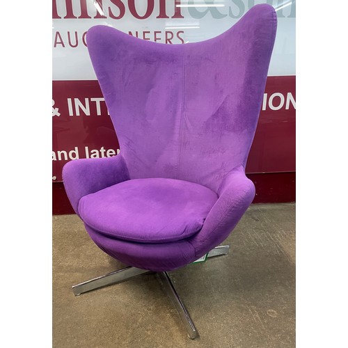 81 - An Arne Jacobsen style chrome and violet fabric upholstered revolving egg chair