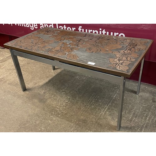 83 - A chrome and brown floral Perspex topped coffee table