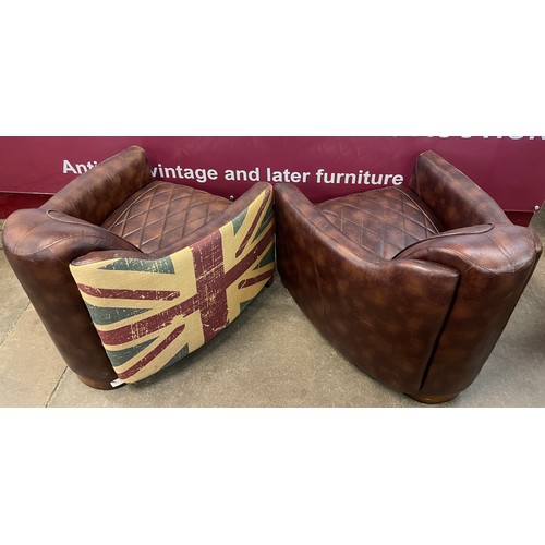 96 - A pair of similar faux brown leather aviator style armchairs, one with Union Jack pattern verso