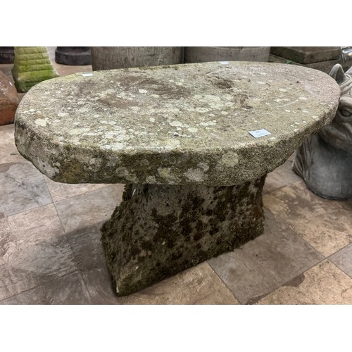 296 - A carved stone garden bench