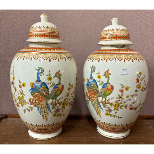 350 - A pair of Oriental ceramic jars and covers