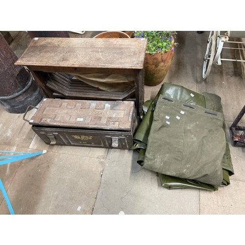312 - A military ammunition box, a military tarp, 5.4 x 4.5cm, a military sack and a folding campaign bed