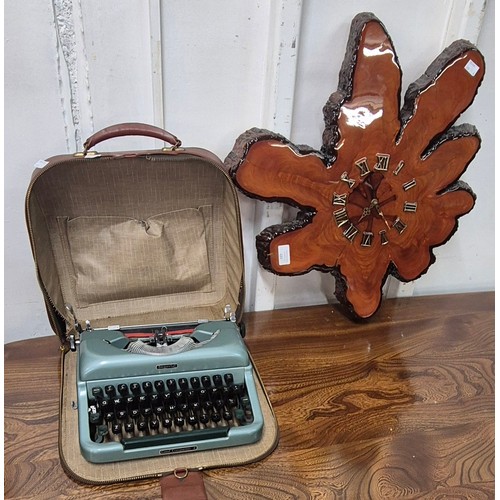 389 - A carved root wood wall clock and a typewriter