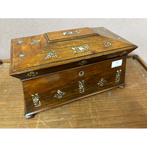 396 - A Regency rosewood and mother of pearl inlaid sarcophagus shaped tea caddy