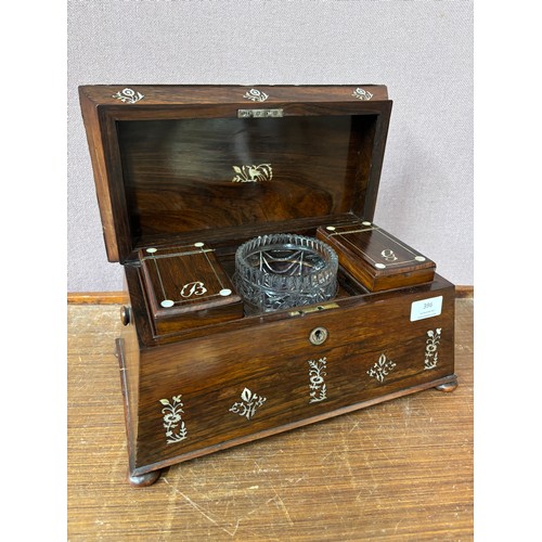 396 - A Regency rosewood and mother of pearl inlaid sarcophagus shaped tea caddy