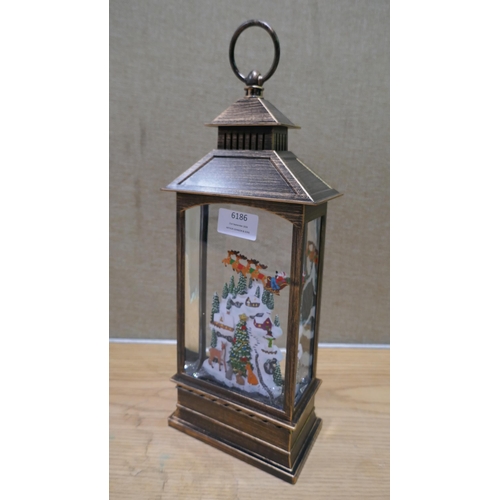 6186 - Holiday Spinning Lantern  (334-455) *This lot is subject to Vat