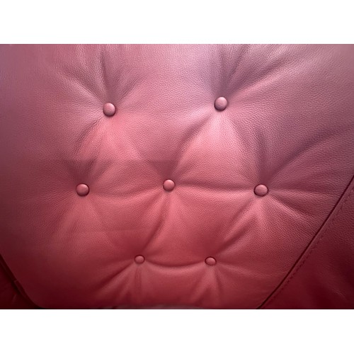 3001 - A pair of red Italian leather buttoned three seater sofas on semi-exposed hardwood frame  *This lot ... 