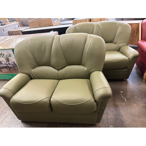 3002 - A pair of green Italian leather two seater sofas  *This lot is subject to VAT