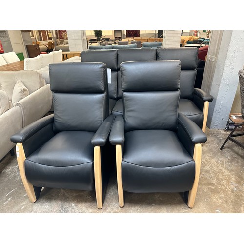 3003 - A black Italian leather three seater sofa, armchair and electric reclining armchair *This lot is sub... 