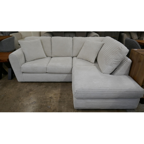 3102 - An ivory jumbo cord compact corner sofa