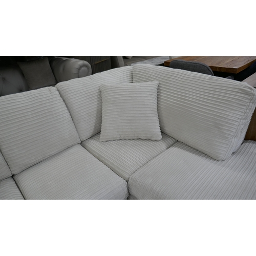 3102 - An ivory jumbo cord compact corner sofa