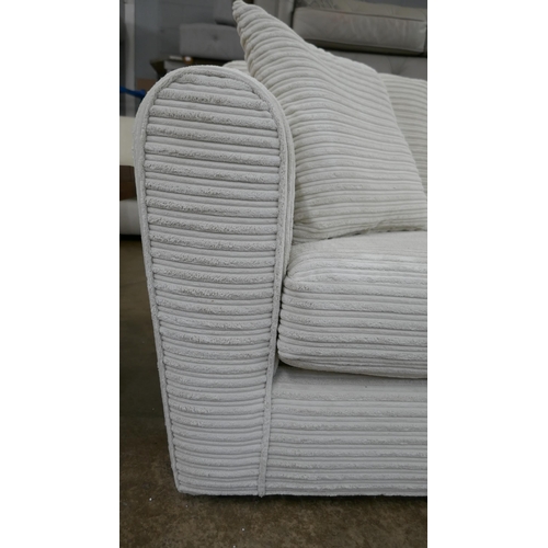 3102 - An ivory jumbo cord compact corner sofa