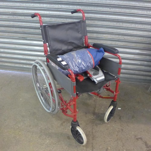 5148A - A large wheeled self propelled wheelchair with footrests and storage bag