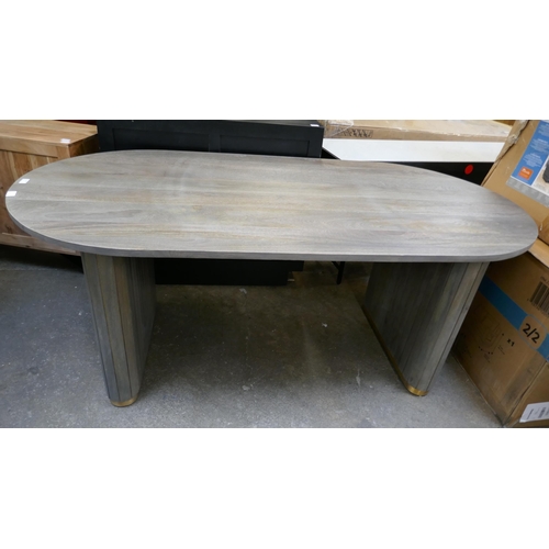 3099 - A grey washed hardwood oval dining table  * This lot is subject to VAT