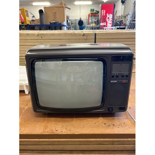 5123 - A portable Phillips TV with remote - late 70s early 80s