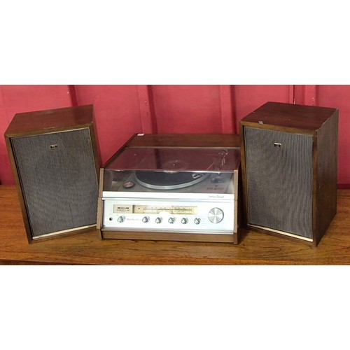 11 - A Sharp 6S-5500 teak record player and a pair of matching Sharp speakers