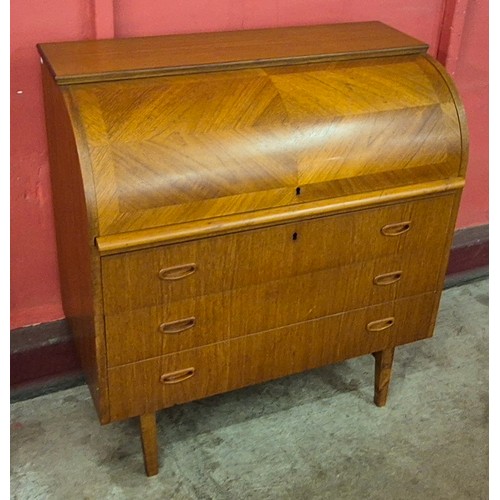 17 - A Swedish S.M.I. teak cylinder bureau, designed by Egon Ostergaard